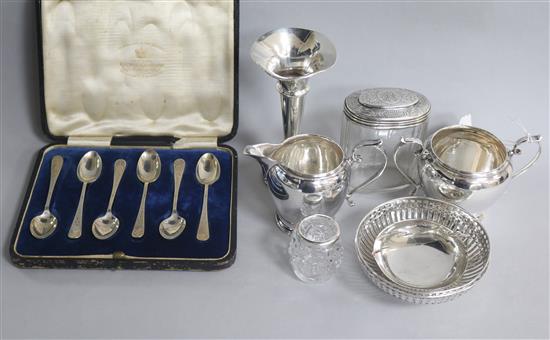 A pair of silver bonbon dishes, a silver cream and sugar, two mounted jars, a dish, a posy vase and cased set of spoons